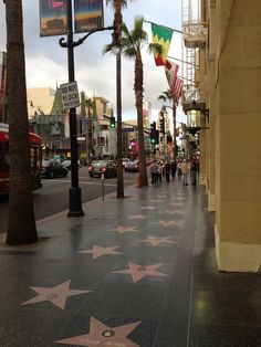 the hollywood walk of fame is lined with stars