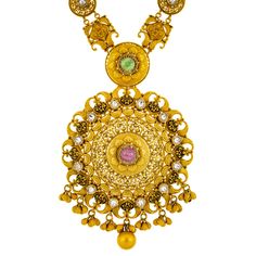 Adorn yourself with the luxurious allure of this 22k gold necklace and earring set from Virani Jewelers. Reflecting the rich heritage of Indian jewelry, this emerald, Kundan, and ruby jewelry set features intricate craftsmanship and a brilliant finish. Perfect for weddings, celebrations, or special occasions, this 22k gold jewelry set exudes elegance and timeless beauty, making it a cherished addition to any jewelry collection. Features • 22k yellow gold • Antique touches • Emerald • Kundan • Ru 22k Yellow Gold Chandbali Kundan Necklace, Yellow Gold Round Temple Necklace With Meenakari, 22k Gold Temple Necklace With Meenakari, Formal 22k Gold Meenakari Temple Necklace, Yellow Gold Round Kundan Necklace In Temple Style, Yellow Gold Round Kundan Necklace Temple Jewelry, 22k Gold Round Temple Necklace With Meenakari, Yellow Gold Round Kundan Temple Necklace, Ornate Kundan Necklace In 22k Yellow Gold