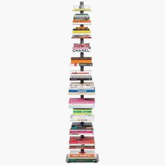 a tall stack of books with the words chanel written on it in black and white