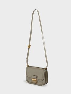 There is beauty in the understated and our Charlot crossbody is proof of that. Whether it is for work or a dinner date, feel your very best when you have this stylish bag next to you. We are loving the gold-tone details which match seamlessly with the sandy taupe hue, plus the elegantly curved corners finish this charming design on a high note. For an extra confidence booster, pair it with a belted shirt dress and edgy sock boots. Charles And Keith Bags, Charles And Keith, Confidence Boosters, Sock Boots, Size Chart For Kids, Belted Shirt Dress, Charles Keith, Dinner Date, Printables Kids