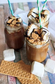 two glasses filled with ice cream and marshmallows