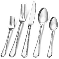 an assortment of silverware including forks, knives and spoons on a white background