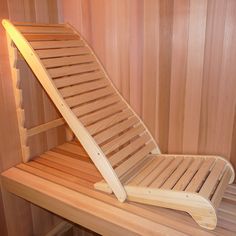 a wooden chair sitting on top of a wooden shelf