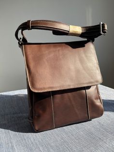 men's shoulder bag in brown leather, handcrafted. Modern Brown Saddle Shoulder Bag, Modern Brown Shoulder Bag, Modern Brown Flap Bag With Adjustable Strap, Modern Brown Satchel With Adjustable Strap, Brown Rectangular Flap Bag For Everyday, Brown Luxury Saddle Shoulder Bag For Business, Luxury Brown Flap Bag For Everyday Use, Modern Brown Saddle Bag For Daily Use, Modern Brown Crossbody Saddle Bag