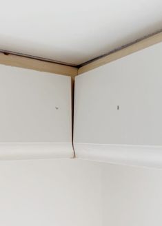 the corner of a room with white walls