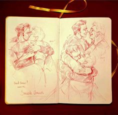 an open notebook with a drawing of two people hugging