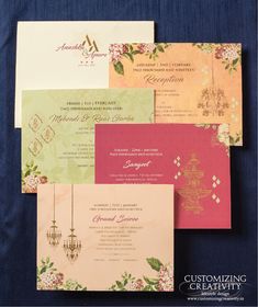 the wedding stationery is laid out on top of each other