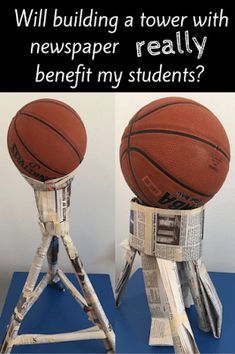 a basketball sitting on top of a metal stand next to a newspaper clipping tower