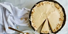 a cheesecake on a plate with a slice cut out and ready to be eaten