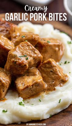 creamy garlic pork bites on top of mashed potatoes