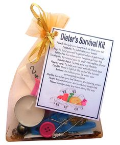 a gift bag filled with sewing supplies and a sign that says, dieter's survival kit