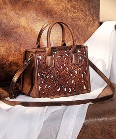 Made of synthetic leather Floral tooled with hand coloring on the front Whipstitch detail Top zipper closure Top handle (Drop: 3.5") Detachable and adjustable crossbody purse straps (Drop: 25.5") 9"(L) x 7"(W) x 4"(H) Interior Capacity: Small Western Style Purse, Montana West Purse, Western Bag, Tool Tote, Western Shoes, Western Purses, Southwestern Print, Work Tote Bag, The Trinity