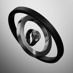 a watch sitting on top of a metal object in the shape of a spiral,