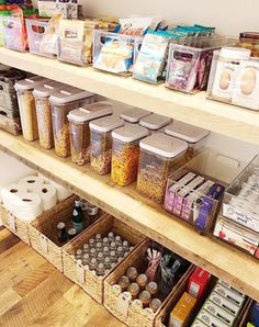 the shelves are filled with many different types of food in baskets and containers on them