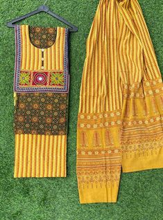 *Rural craft of rajasthan(India)* New in *#festivalcollection* *ajrakh  print Suit pcs with hand embroidery yoke*   Pure cotton Fabric with ajrakh print designer Salwar suit pc Along with ajrakh print Bottom & cotton  Duppatta Available in Attractive colors and designs  Lenght:  top: 2.5 mtr Bottom : 2.5 mtr Dupatta: 2.5 mtr Msp =3750 Limited stock Handloom and handcrafted ajrakh printed  suits and dupatta for women are here. Only Few Are in the Stock. Hurry Up! Please Note- Shades may slightly Traditional Anarkali Set With Kalamkari Print, Patterned Cotton Lawn Suit With Printed Border, Cotton Lawn Suit With Printed Border, Traditional Chanderi Palazzo Set With Bandhani Print, Patterned Cotton Unstitched Suit With Printed Motifs, Traditional Unstitched Bandhani Print Sets, Cotton Kurta With Printed Border For Diwali, Cotton Block Print Palazzo Set For Festivals, Diwali Cotton Kurta With Printed Border