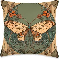 an orange butterfly sitting on top of a green and brown pillow with floral designs around it