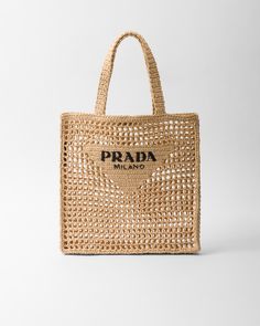 Raffia-effect yarn Crochet workmanship Embroidered lettering logo on the front Unlined London Spring Outfit, Crochet Logo, Prada Tote Bag, Lettering Logo, Crochet Tote Bag, Crochet Tote, Mens Fragrance, Beauty Accessories, Prada Bag