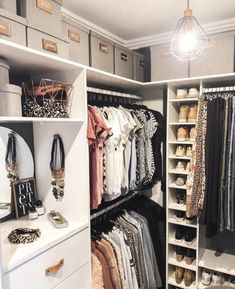 an organized closet with clothes and shoes