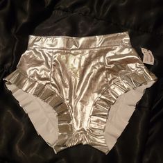 A Must Have For Summer!! Perfect For Partying. Concerts. Festivals. Whatever You Want! These Have Stretch. Super Metallic Silver Look. Rave Bottoms For Spring Night Out, Spring Rave Bottoms For Night Out, Disco Style Bottoms For Spring Costume Party, Rave Style Bottoms For Spring Night Out, Summer Fitted Metallic Bottoms, Rave Party Shorts With Stretch, Stretch Rave Party Shorts, Stretch Rave Shorts For Party, Fitted Rave Shorts For Party