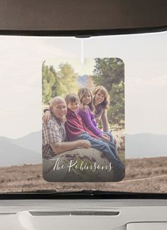 a family photo hanging on the back of a car