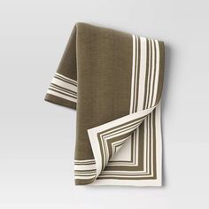 the folded towel is brown and white