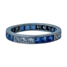 Art Deco Platinum Sapphire and Diamond Full Eternity Band Ring delightful sapphire and diamond stone ring, truly sparkles The item comes without the box in the photos but will be presented in a gift box Measurements: weight 2.63g, size UK M1/2, height off finger 2mm Materials : platinum, sapphire and diamond Hallmarks: none present Condition : The overall condition is very good office use: TC2 Classic Sapphire Eternity Band For Anniversary, Blue Brilliant Cut Eternity Band For Anniversary, Anniversary Platinum Sapphire Ring Channel Set, Anniversary Sapphire Ring In Channel-set Platinum, Classic Diamond Eternity Band With Gemstones, Anniversary Sapphire Ring Channel Set In Platinum, Sapphire Diamond Rings With Channel Set, Channel Set Lab-created Sapphire Ring, Diamond Sapphire Ring With Channel Set For Anniversary