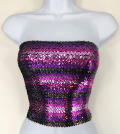 Pink, Fuchsia, Purple and Brown Striped Sequin Strapless Tube Top is made with high quality sequins on the outside, as well as polyester on the inside. The size of the tube top is 12 inches wide and 10 inches tall when flat. It is also stretchy and form fitting as well. If you have any questions about our products or have any inquiries please contact us and I will be glad to help. *Since this item is hand-made, the design can vary slightly from the image.