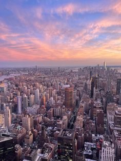 an aerial view of new york city at sunset