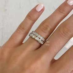 A modern update to the classic eternity band. Platinum or 14k solid gold Diamonds: G/H color VS clarity 1.62 carats, 18 diamonds (~.08 pt each) Carat total weights based on finger size 6 3.1 mm width For this style, we recommend ordering 1/4 of a size larger from your true finger size to accommodate any future size fluctuations as eternity bands cannot be resized. All eternity bands are custom made to order and will be final sale. This item is Final Sale and excluded from all promotional discoun Bezel Eternity Ring, Yellow Gold Eternity Band Diamond, Anniversary Jewelry With Baguette Diamonds In Diamond White, Anniversary Diamond White Baguette Jewelry, Anniversary Baguette Diamond White Jewelry, 14k Gold Jewelry With Baguette Diamonds In Diamond White, 14k Gold Jewelry With Silver Baguette Diamonds, Everyday Luxury 14k Gold Diamond White Diamond Ring, 14k Gold Silver Jewelry With Baguette Diamonds