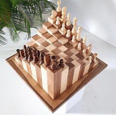 a wooden chess board with pieces on it