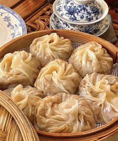 some dumplings are in a basket on a table