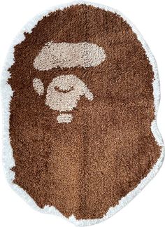 a brown and white rug with a monkey on it's face in the middle