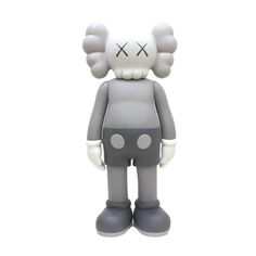 a gray and white toy with big ears on it's head, standing in front of a white background