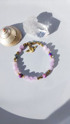 Please read to the end before ordering. . Adjustable bracelet in Kunzite stones and Sediment Jasper with small Egyptian scarab charm. Stainless steel . IMPORTANT All our shipments are in standard follow-up letter or simple colissimo depending on the item selected. . We are not responsible for the delay / loss / theft with the "standard shipment" option or colissimo without insurance. . If you would like insurance in the event of loss or theft, please choose the insurance option that suits you in the basket. for international choose "insurance" before ordering. . Due to the current health crisis, delivery times may be affected. . If you are unsure or have any problems please contact me before ordering. . In the event that there is a problem, for orders under €250 the complaint will be made Gold Agate Crystal Bracelet For Healing, Adjustable Gold Rosary Bracelet With Natural Stones, Gold Spiritual Crystal Bracelet With Natural Stones, Spiritual Gold Gemstone Charm Bracelet, Spiritual Gold Charm Bracelet With Gemstones, Spiritual Gold Charm Bracelet With Gemstone Beads, Gold Hand-strung Rosary Bracelet For Healing, Gold Rosary Bracelet For Healing, Gold Spiritual Rosary Bracelet For Healing