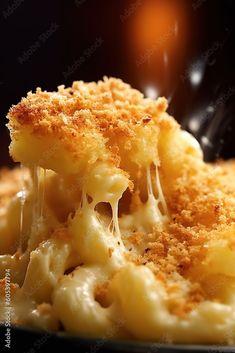 macaroni and cheese being lifted with a fork