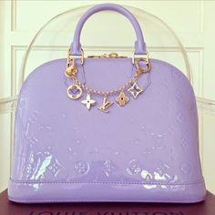 a purple purse sitting on top of a table