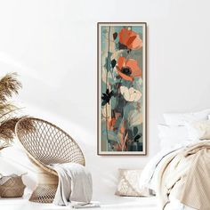 a bedroom with white walls and an art piece hanging on the wall next to a wicker chair