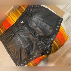 “Sparkle & Fade” Genuine Leather Black Mini Shorts Lined With Silver Metal Grommets. Size 8. Runs Small And Fits Like A Size 4. Length: 11.5” From Top To Bottom 16.5” Wide Black Mini Shorts, Black Leather Bottoms With Built-in Shorts, Leather Shorts With Built-in Shorts, Mini Shorts, Black Mini, Metallic Silver, Size 4, Genuine Leather, Womens Shorts