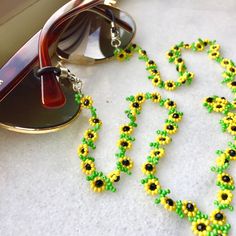 This handmade sunflower jewelry for women is meticulously hand-woven from the finest glass seed beads. Handmade beadwork, eyeglass chain is lightweight and comfortable to carry, so your glasses will not be lost. Lenght 80 cm 31,5 inches The fashion sunflower eyeglass necklace, which is suitable for every outfit and can be used in every season, is the ideal style gift eyeglass chain for you and your loved ones. Guaranteed to receive all compliments. It's not just an eyeglass chain! it is also sunflower necklace, wrap bracelet, cute reading glasses and multi-purpose beaded eyeglasses chain. You can click the link for my other handmade beadwork jewelry and accessories! https://yasminjewelrygifts.etsy.com If there is a color and pattern you want, I will do it for you, you can write a message. Cute Reading Glasses, Cottagecore Accessories, Glasses Necklace, Glasses Lanyard, Beaded Sunglasses, Handmade Sunflower, Rainbow Accessories, Eyeglasses Chain, Cottagecore Jewelry