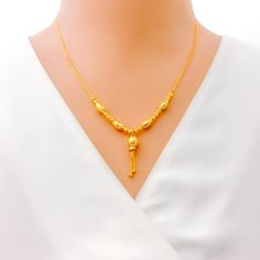 This bold 22k gold necklace exudes elegant sophistication, making it a standout piece for any refined ensemble. Weighing 8.1 grams, it offers a lightweight yet luxurious feel. The radiant yellow gold finish enhances its timeless beauty and striking appeal. With a necklace length of 18.5 inches and a drop length of 1 inch, this piece is designed to complement your neckline with grace. The secure lobster lock ensures confident and comfortable wear. Elevate your jewelry collection with this exquisitely crafted necklace, ideal for bringing a touch of bold elegance to both everyday and special occasions. PRODUCT DETAILS Gold Purity(karat): 22k Gold Weight(grams): 8.1 Item Finish: Yellow Gold Necklace Length: 18.5" Drop Length: 1" Lock Style: Lobster Lock 22k Gold Formal Necklace For Festive Occasions, Formal 22k Gold Necklace For Festive Occasions, Festive Yellow Gold Necklace For Formal Occasions, Festive 22k Yellow Gold Necklace, 22k Gold Necklace With Delicate Chain, Elegant Gold Necklace With Delicate Chain, Elegant 22k Gold Necklace For Festive Season, Festive 22k Gold Elegant Necklace, Festive Yellow Gold Plated Necklaces