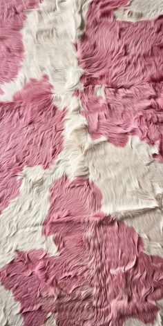 a pink and white area rug on the floor