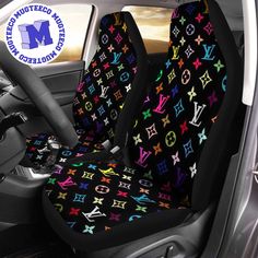 the interior of a car with multicolored monogrammed stars and letters on it