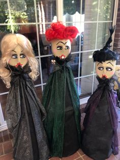 three creepy dolls sitting next to each other