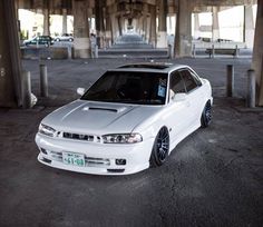 a white car parked in an empty parking lot