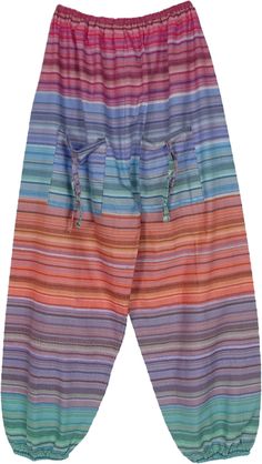 A assorted multicolored striped pattern woven cotton ankle length elastic bottom pants with two beautiful deep utility front pockets.  These pockets come with strings that gives these pants a bohemian hippie look. #tlb #SplitSkirtsPants #Pocket #Yoga #vacationclothing #beachwrap #Striped #bohemianfashion #CottonPantswithpockets #Unisexbohopants #Bohocargopants #multicoloredpants Bohemian Striped Bottoms For Spring, Multicolor Cotton Bottoms With Side Pockets, Multicolor Harem Pants With Pockets For Festival, Hippie Multicolor Harem Pants With Pockets, Bohemian Bottoms With Side Pockets, Multicolor Harem Pants With Pockets, Relaxed Fit Multicolor Hippie Bottoms, Colorful Bohemian Cotton Bottoms, Multicolor Cotton Harem Pants For Beach