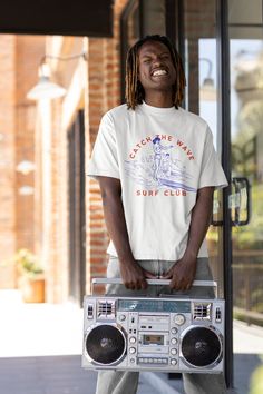 Embrace the surf lifestyle with our 'Catch the Wave Surf Club' tee, perfect for beach lovers and surf enthusiasts alike. Care instructions: Machine wash: warm (max 40C or 105F); Non-chlorine: bleach as needed; Tumble dry: medium; Do not iron; Do not dry-clean. Processing Times: We will process your order within 3 days and have it sent to our courier! How long does delivery take? We offer free worldwide delivery on all of our products, but please give us some leeway as we have multiple warehouses Casual Short Sleeve T-shirt For Water Sports, Sporty Crew Neck T-shirt For Surfing, Summer Water Sports Short Sleeve T-shirt, Crew Neck Tops For Water Sports In Summer, White Short Sleeve Surfing T-shirt, Short Sleeve Graphic Print Tops For Water Sports, Casual Tops For Water Sports In Summer, Casual Summer Tops For Water Sports, Casual Short Sleeve Tops For Water Sports