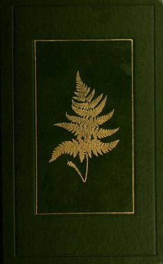 a green book with a gold leaf on it