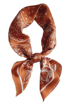 an orange and white scarf with paisley designs on the front, tied in a loop