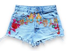 "Pre Loved  Denim cutoff shorts featuring embroidered flower appliqué,  high waist   silhouette with raw hem. Handmade embroidery  This is a unique item made with love in a friendly workspace ! All our products are handmade and constructed from pre existent materials that were either discarded or coming from vintage stores !!  All our clothing are made with recycled materials.   We all know how harmful clothing waste can be to our beloved planet, so help us spread upcycle love and buy clothing that is part of a solution rather than the cause of a problem. Welcome to our community !  Details :  MEDIUM  ligth wash  W27/28 *Rise: 11.5\" *Inseam: 2.5\" Pre - loved item ❤️" High-waisted Shorts With Floral Embroidery For Spring, High Waist Floral Embroidered Jeans For Summer, Denim Shorts For Summer Festival, High Waist Floral Embroidered Shorts For Spring, Summer Festival Denim Shorts, Casual Cutoff Shorts With Floral Embroidery, Casual Embroidered Cutoff Shorts, Denim Cutoff Shorts For Festivals, Embroidered High Waist Summer Shorts