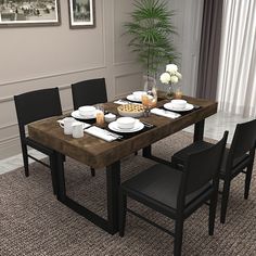 a dining room table with plates and cups on it